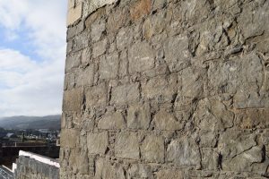 The bottom of the East Wall of St Mary’s behind the choir gallery showing the dressed stone, quoins and parallel coursing